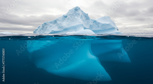 Majestic iceberg reveals its immense underwater structure beneath crystal clear Arctic waters during an epic polar expedition