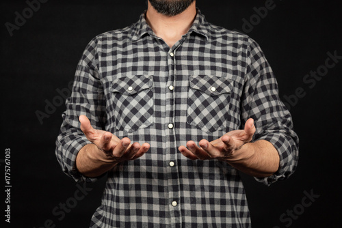 a modern man ready to holding or receiving something with both hands in front of him