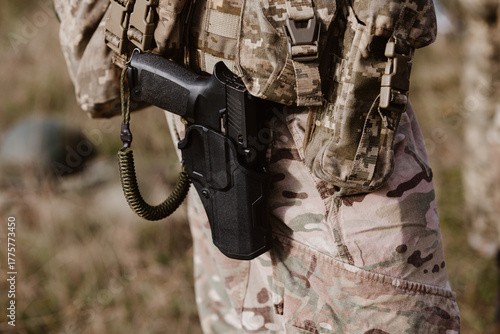Photos A soldier's pistol in a tactical holster.