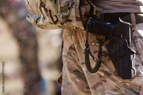 Canvas Print A soldier's pistol in a tactical holster.