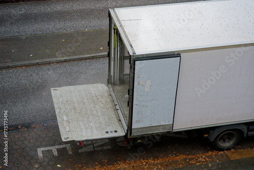 Photos Open delivery truck with hydraulic lift gate ready for loading logistics and tra