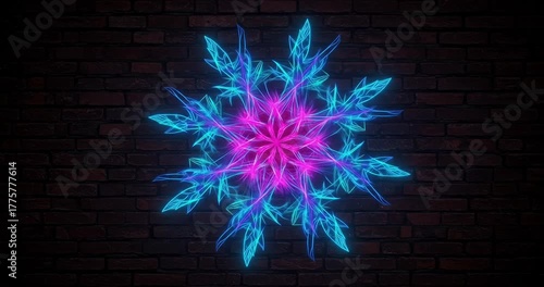 Vibrant neon snowflake design against a dark wall