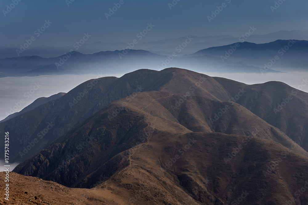 Fototapeta premium Coastal morning Fog Drifts Over the Peruvian Andes
