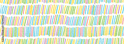 Colorful small lines seamless pattern in a playful kids style. Hand-drawn dashes and short vertical lines seamless design. Bright graphic print, childish wallpaper, and dashed wrapping paper.