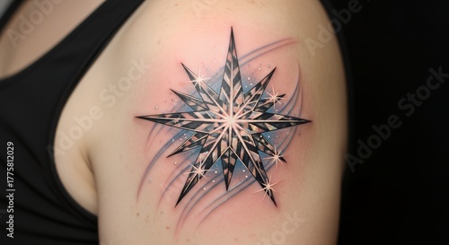 Black and Gray Geometric Snowflake Tattoo on Shoulder with Sparkling Highlights
