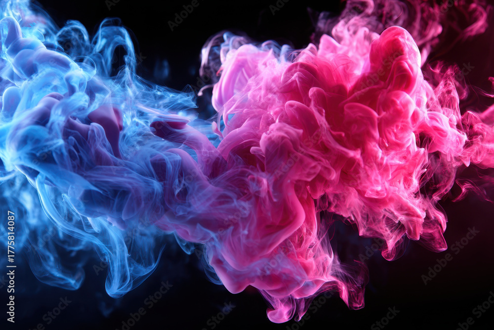 Obraz premium Colorful smoke swirling in vibrant pink and blue hues against a dark background