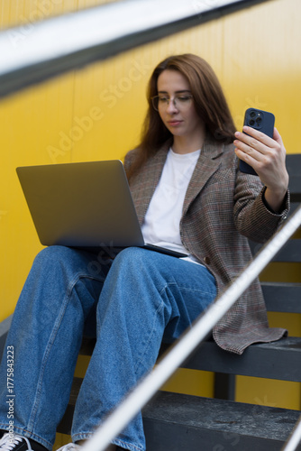 Modern Woman Working Outdoors with Laptop – Urban Freelance Lifestyle