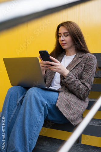 Modern Woman Working Outdoors with Laptop – Urban Freelance Lifestyle