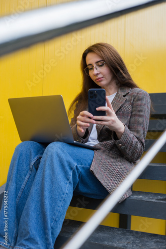 Modern Woman Working Outdoors with Laptop – Urban Freelance Lifestyle