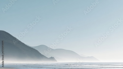 Serene Coastal Landscape with Misty Mountains and Calm Ocean Scenery on a Sunny Day