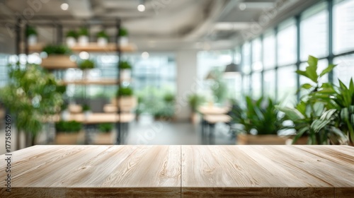 Wallpaper Mural Wooden Tabletop in Modern Office Space Featuring Green Plants and Natural Light Background for Product Display Torontodigital.ca