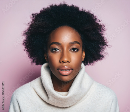 African woman wearing white turtleneck sweater against pink background
