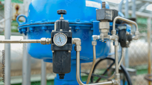 An air regulator adjusts airflow pressure to control actuator valves,