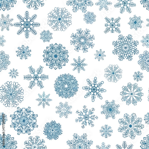 A seamless pattern featuring a multitude of intricate, detailed blue snowflakes scattered across a white background.
