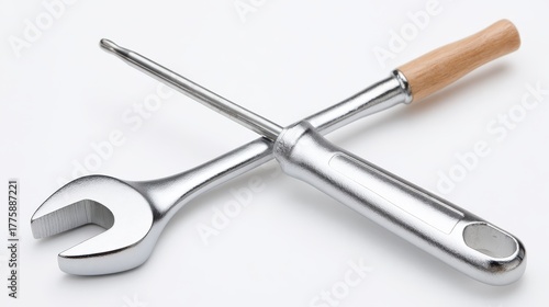 Wallpaper Mural A chrome-plated combination wrench and a screwdriver with a wooden handle crossed on a bright white background. Torontodigital.ca
