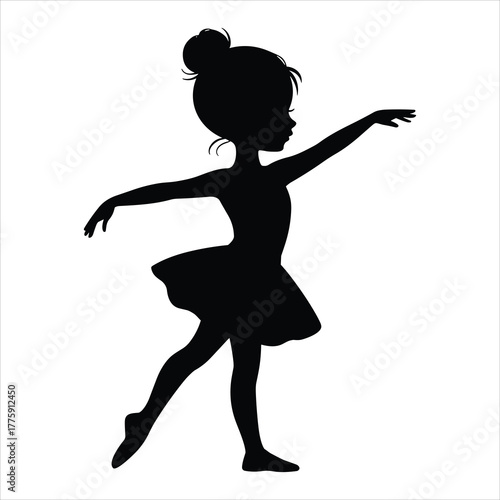 Black silhouette of a young girl in a ballet pose with arms outstretched and hair in a bun child dancer