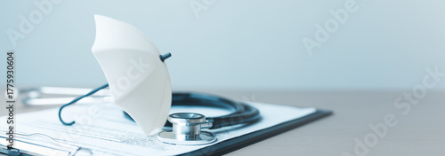 Bild auf Leinwand health, insurance, medical, policy, coverage, hospital, A stethoscope and umbrella on health insurance documents represent protection, healthcare coverage, and medical safety concepts