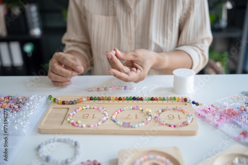 Senior mature older asian woman Art hobby handmade making beads jewellery accessories handcraft hobby