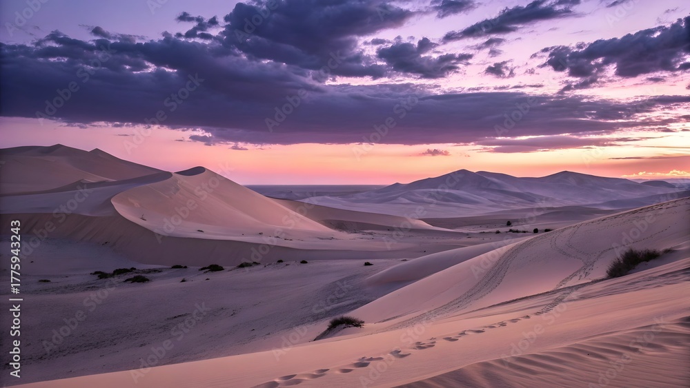 Naklejka premium Serene desert dunes under a dramatic sunset sky