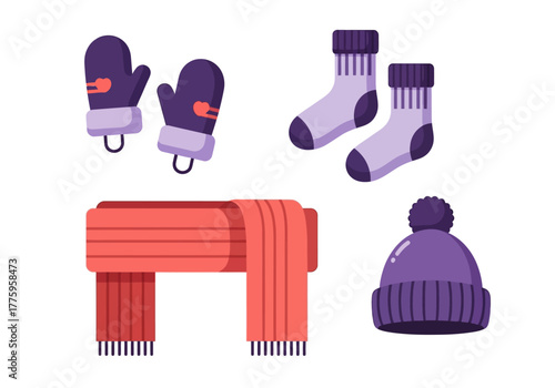 Winter accessories mittens socks scarf and hat arranged on a plain background