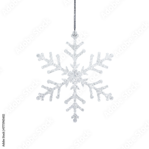 A delicate, sparkling Christmas snowflake ornament, intricately designed and glistening against a pristine white background, perfect for holiday decorations and festive winter themes