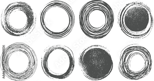 Eight dark grey circular brush stroke graphic elements on white background circle abstract