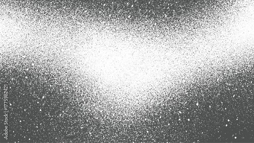 Monochrome speckled gradient background with dense dark speckles fading to white abstract black
