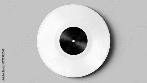 Overhead view of a white vinyl record with a black label