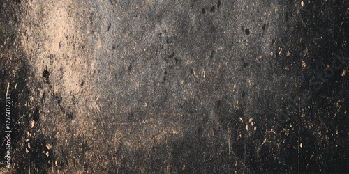 Textured black grunge wall design with cracked distressed surface old industrial tone abstract rough background.