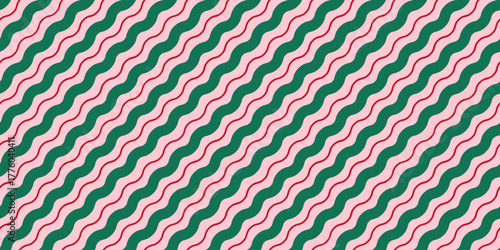 Christmas seamless pattern. Candy cane background with red, pink and green lines