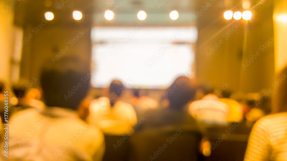 Naklejka premium Blurred background people join seminar business event in auditorium hall convention. Presentation meeting at conference room present screen business. Blurred background with copy space