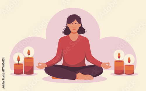 Woman meditating with eyes closed surrounded by lit candles