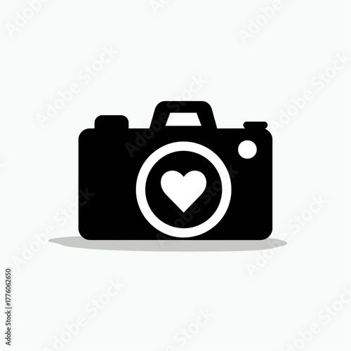 Black camera icon with a white heart in the lens, symbolizing love for photography.