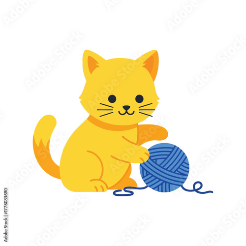 Cute playful yellow kitten paws at a blue ball of yarn on