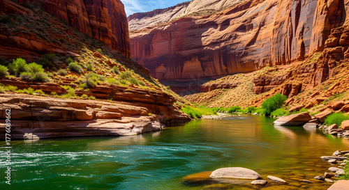 Scenic Colorado River winding through majestic canyon landscape under blue sky