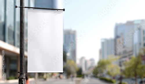 Stylish photo of vertical blank white banner on a pole in a city street
