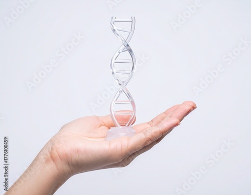 Scientist's hand holding a transparent glowing DNA double helix structure