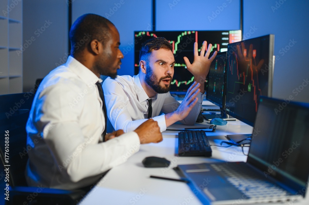 Fototapeta premium Stressed business mans crypto trader broker investors analyzing stock exchange market crypto trading