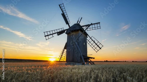 Rustic Wooden Windmill at Sunset | Golden Wheat Field Countryside Video
Silhouetted Windmill Against Vibrant Sky | Peaceful Rural Evening Landscape Footage