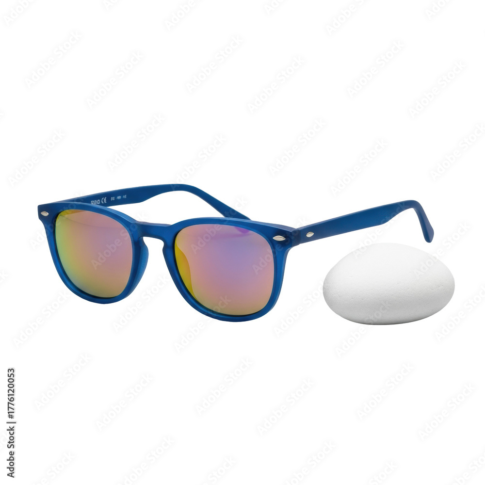 Fototapeta premium Vibrant blue modern sunglasses with reflective lenses mirroring orange/purple hues, next to a smooth white beach pebble, isolated on a clean transparent studio background. Commercial product