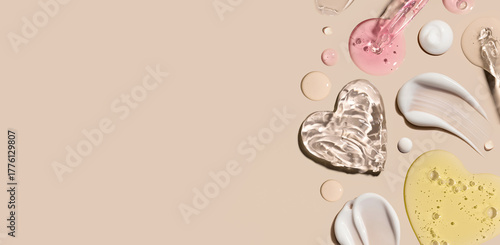 samples of cosmetic care products smear of cream texture on a beige background