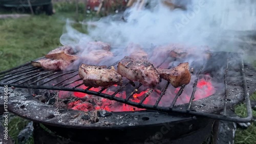 fried pork belly on coals in the smoke. High quality 4k footage