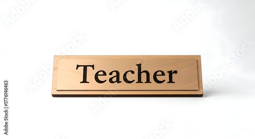A single desk nameplate engraved “Teacher,” clean white background