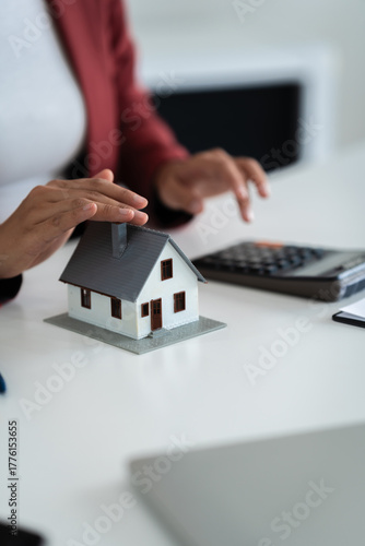 Wallpaper Mural financial expert reviews house contract and loan calculation in office Torontodigital.ca