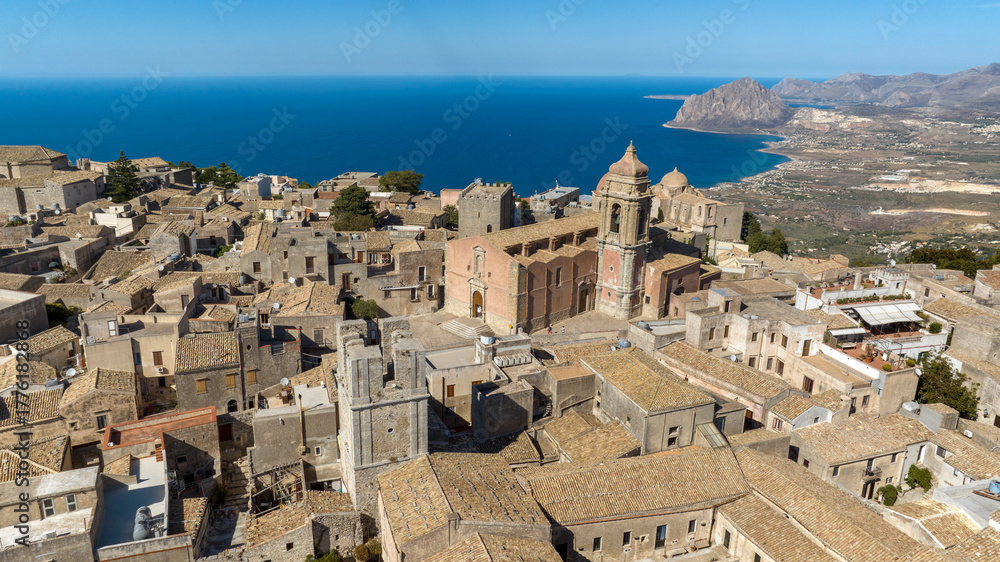 Obraz premium Aerial view of San Giuliano church. It's a Roman Catholic church in the historic center of Erice, Sicily, Italy. It's one of four parish churches in the town. The Mediterranean Sea is in background.