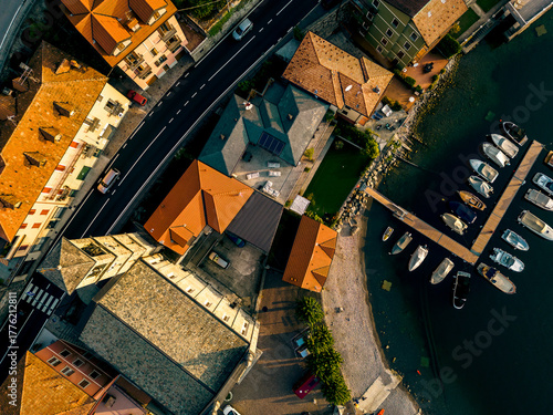 Tableau sur toile Aerial view of the harbour in Argegno village on the shore of Lake Como at sunri
