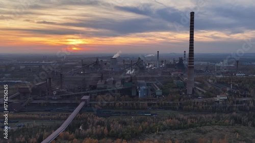 Aerial drone view of Industrial steel factory, iron works. Metallurgical plant. steelworks. Heavy industry in Europe, Poland, Dabrowa Gornicza. Air pollution from chimneys. Ecology and environmental