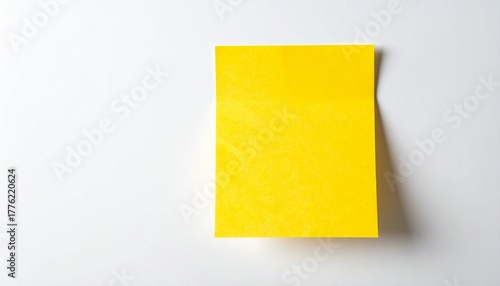 Yellow sticky note with hand-drawn smiley face on white background.