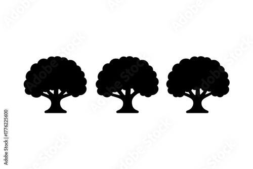 Three stylized trees in silhouette showcasing simple shapes and flowing lines, representing nature and tranquility during daytime
