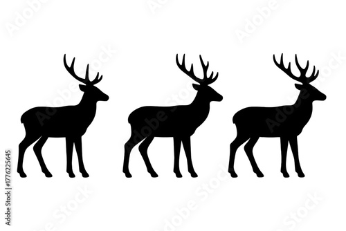 Silhouette of three deer walking in a row under soft lighting